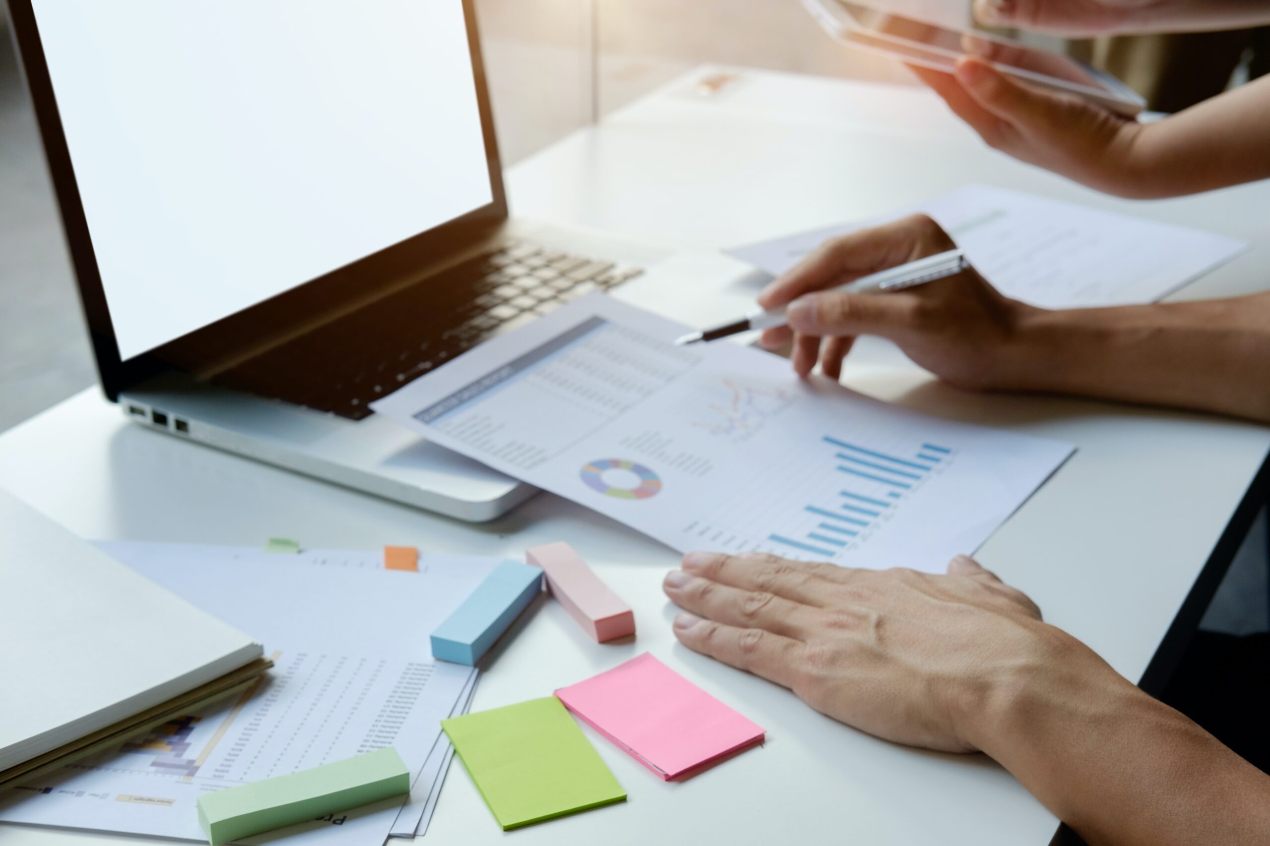 Report with KPIs and laptop for lawyer marketing plan